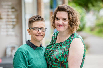 Portrait of young couple standing outdoors