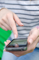 Young woman using her phone