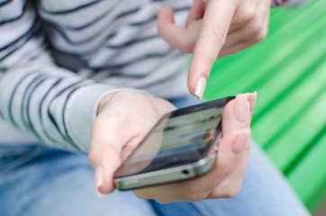 Young woman using her phone