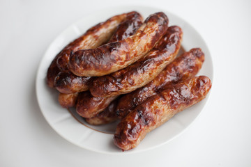 Pile sausage on white plate