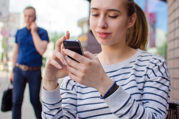 Young woman using her phone