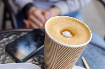 Young woman with tasty coffee 