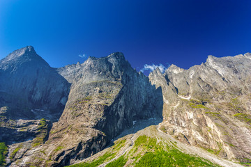 Obraz premium Mountains with green gras and blue sky, Andalses, Norway
