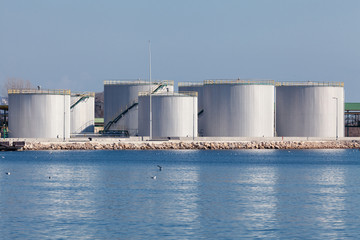 Obraz premium large tanks for petrol and oil, blue sky