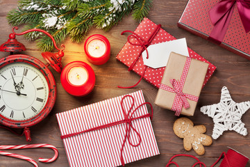 Christmas gift boxes, alarm clock and fir tree