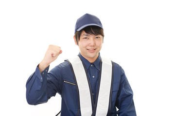 ガッツポーズの労働者