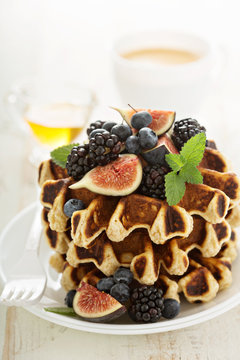 Fluffy breakfast waffles with fresh fruits