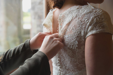 Lacing up a wedding dress