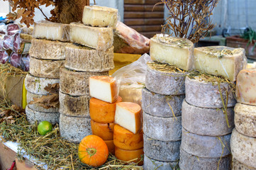 cheese on sale at an italian market - 125522923