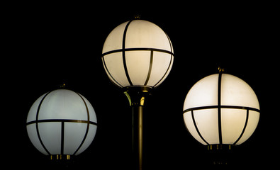 Round glass multi-colored light on a black background.