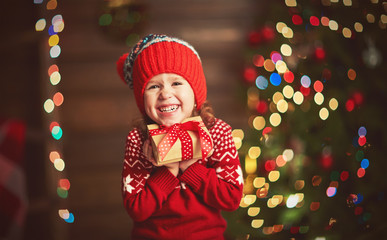 happy child girl with Christmas present