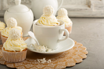 Coconut cupcakes with white frosting