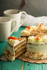 Slice of carrot cake with cream cheese frosting