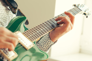 man playing electric guitar