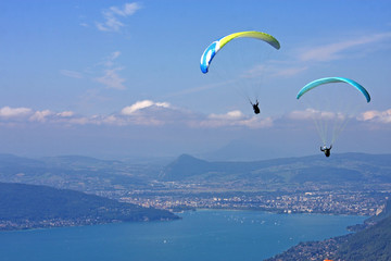 Paragliders above Lake Annecy