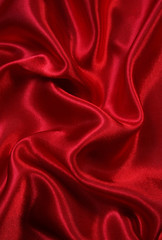 Fototapeta na wymiar Smooth elegant red silk as background