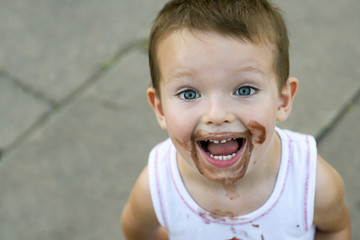 boy smeared ice cream. dirty boy