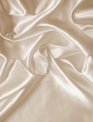 Obraz premium Smooth elegant golden silk as wedding background. In Sepia toned
