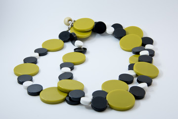 Decoration of beads of stone an olive green. Plastic retro beads