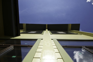 the facade of a wooden house on a background of sky