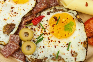 Fried Eggs on a plate. A hearty breakfast for athletes. Healthy food.
