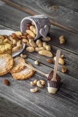 chocolate and nuts on wooden background