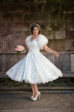 Lady swooshes her vintage retro wedding gown
