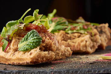 food background of Bread with duck meat and salad