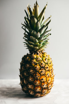 pineapple on white table. white background with copy space