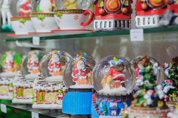Fototapeta premium Colorful close up details of christmas fair market. Snowball decorations for sales