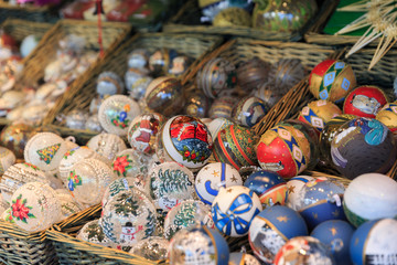 Colorful close up details of christmas fair market. Balls decora