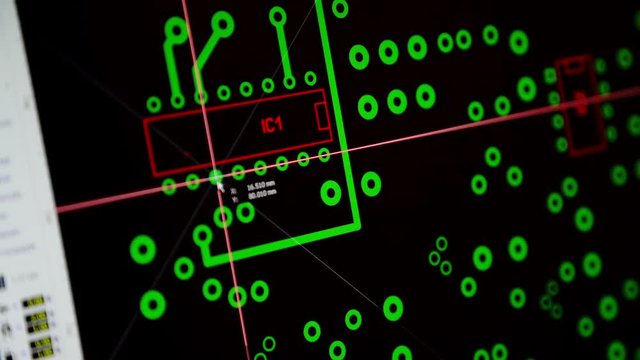 electronic engineer designing a printed circuit board with PCB layout software