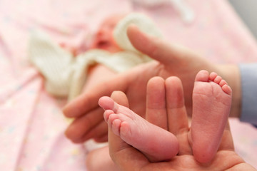 Infant heels in  fathers hands