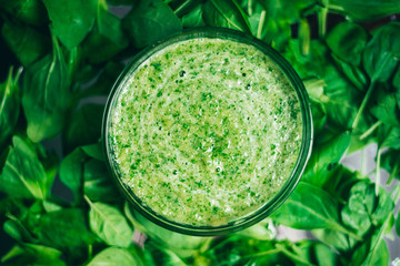 Fresh green juice smoothie made with organic green fruits and vegetables. top view, the texture of the leaves. The concept of a healthy lifestyle - 125537536