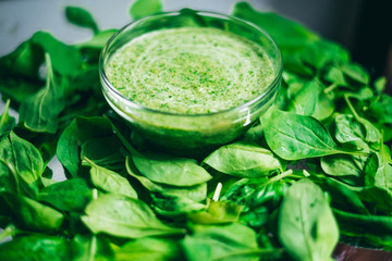 Fresh green juice smoothie made with organic green fruits and vegetables. The texture of the leaves. The concept of a healthy lifestyle