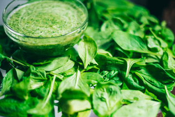 Fresh green juice smoothie made with organic green fruits and vegetables. The texture of the leaves. The concept of a healthy lifestyle