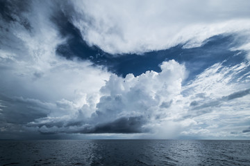 Fototapeta na wymiar Dark clouds in open ocean