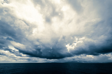 Dark clouds in open ocean