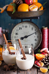 Eggnog with cinnamon in a rustic setting
