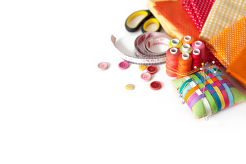 Accessories for sewing lie on a white background. Measuring tape