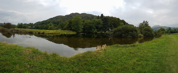 Panoramic view of pond in Ambleside countryside, Cumbria, UK
