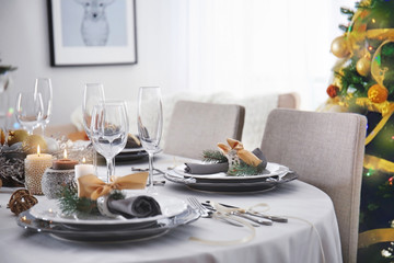 Table served for Christmas dinner in living room