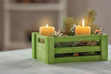 Green wooden box with Christmas decoration on table