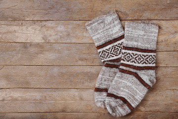 Winter socks on wooden background