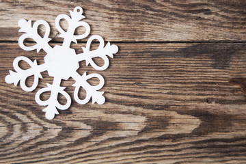 Snowflakes border on grunge wooden background. Winter holidays concept