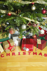Christmas presents under an illuminated Christmas Tree