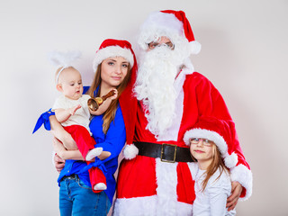 Happy family together with Santa Claus.