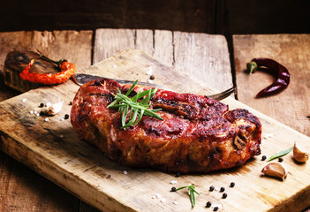 Baked pork shoulder with pepper, rosemary and garlic, vintage wo