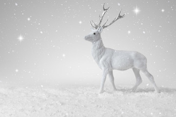 Snow falling on a White Christmas Reindeer