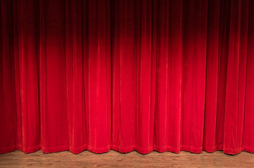 Stage With Closed Red Curtains
